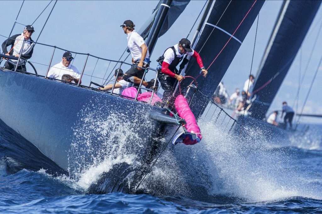 Jethou sailing upwind, crew preparing kite.