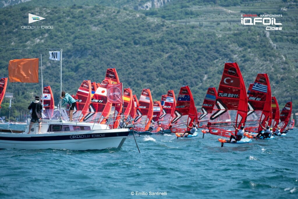 Fleet sailing upwind after race start.