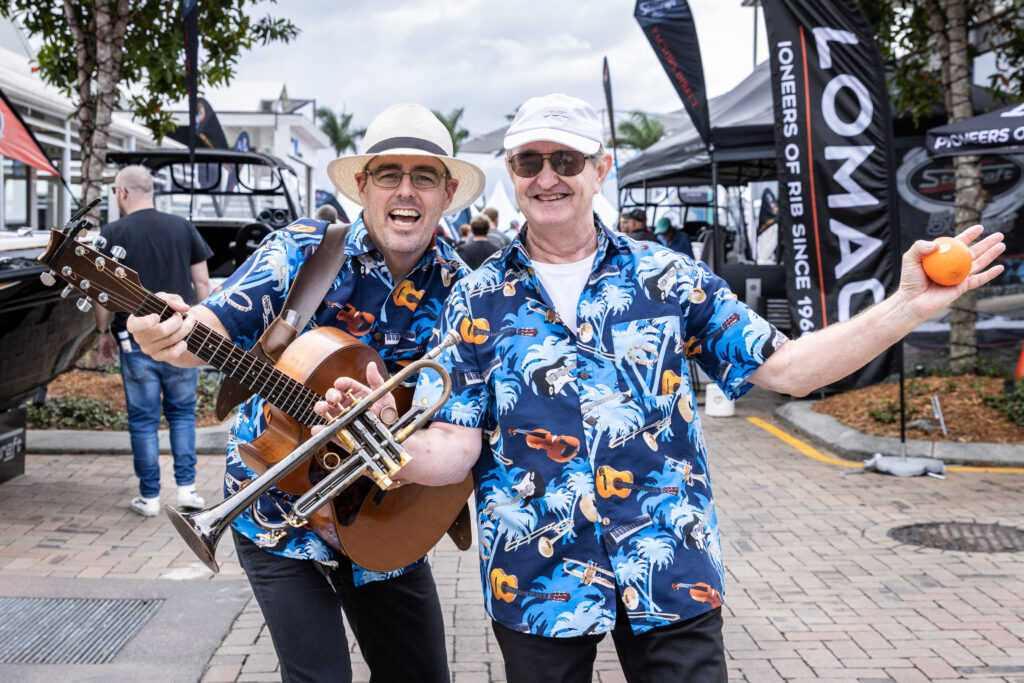 Two musicians smiling for the camera.