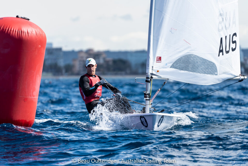 Matt Wearn sailing downwind passing a mark.