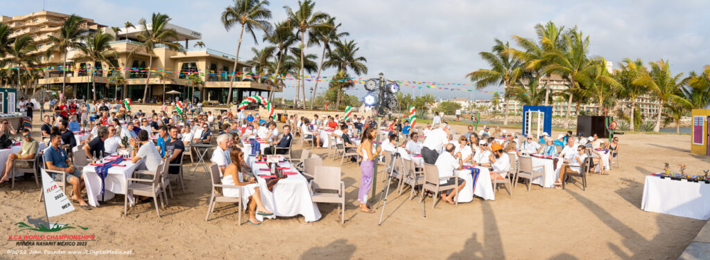 People at tables outside.