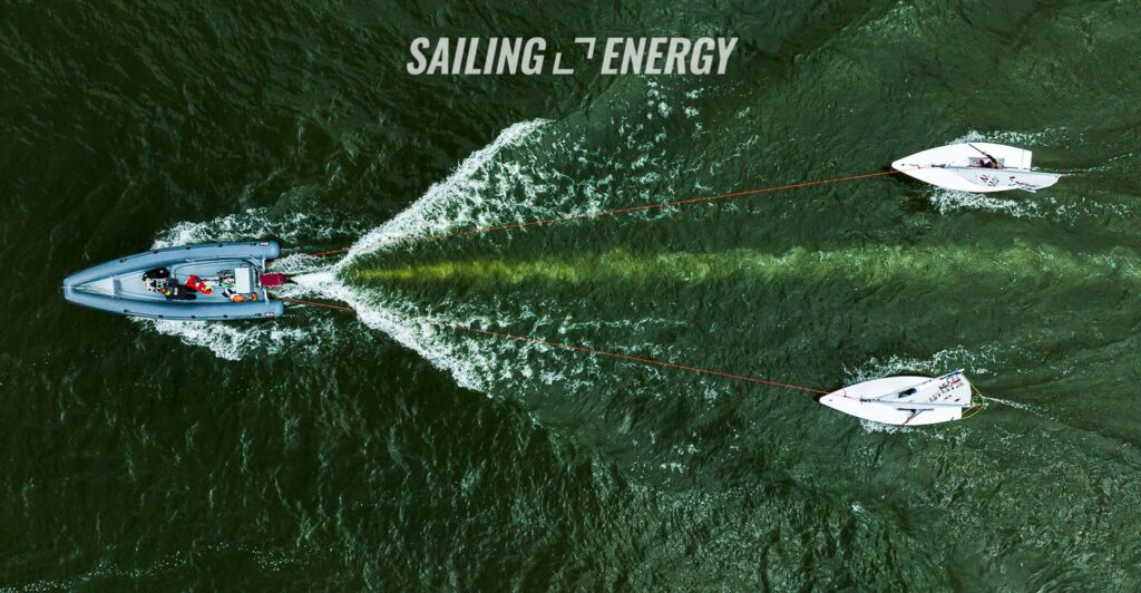 Aerial shot of two lasers being towed behind RIB.