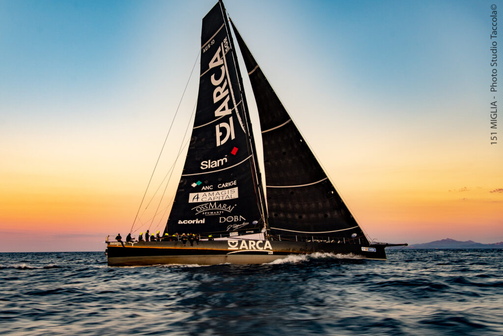 ARCA SGR sails upwind at sunset.