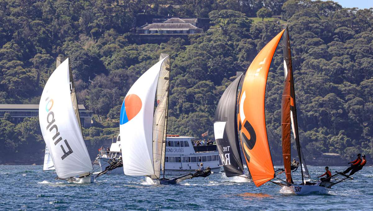Leading a group of backmarkers down the NE spinnaker run (SailMedia)
