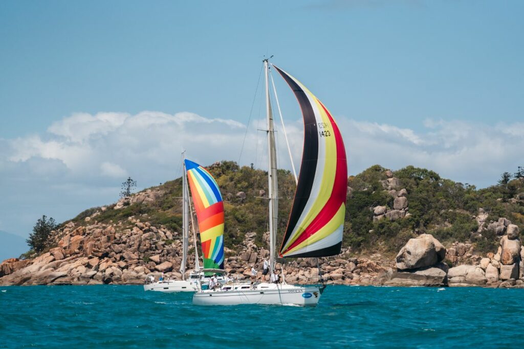 Spinnakers and Maggie Island backdrop - Revolution Productions pic