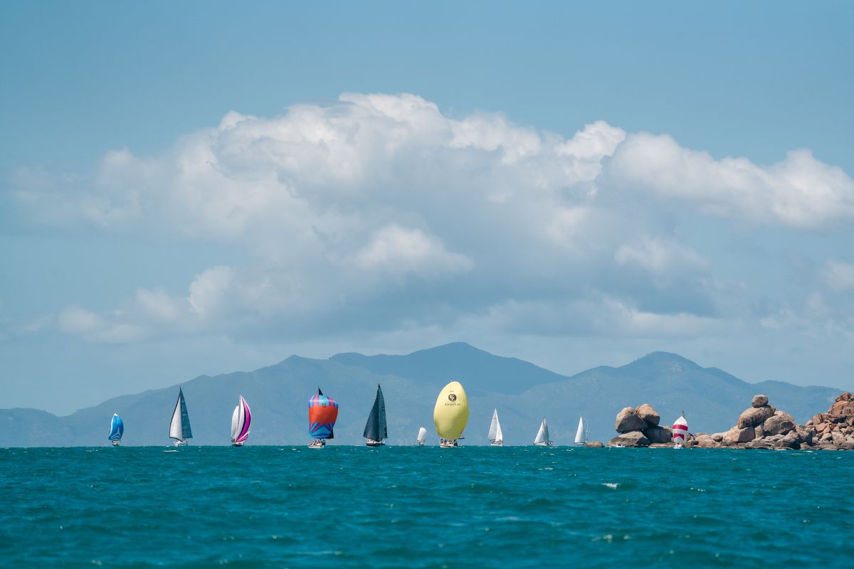 Orchard Rocks, Maggie Island backdrop and spinnakers make a dramatic picture - Revolution Productions pic