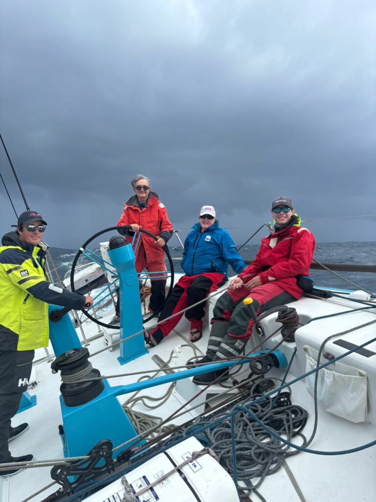 Richard Hudson at the helm of Antipodes - pic courtesy Rob Buchanan, Antipodes