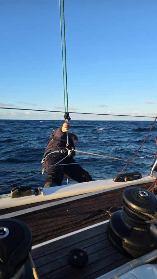 Callum Cecil retrieving a spinnaker sheet - pic courtesy Cooloola