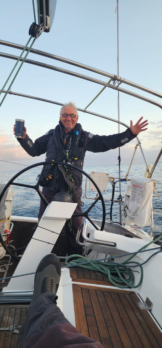 Ian Edwards at Wings helm - no wind but so what - pic courtesy Wings