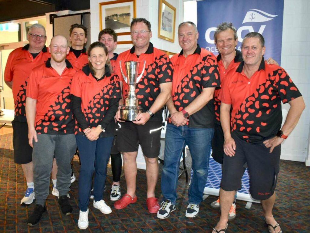 Scarlet Runner_ skipper David Sturge holding trophy