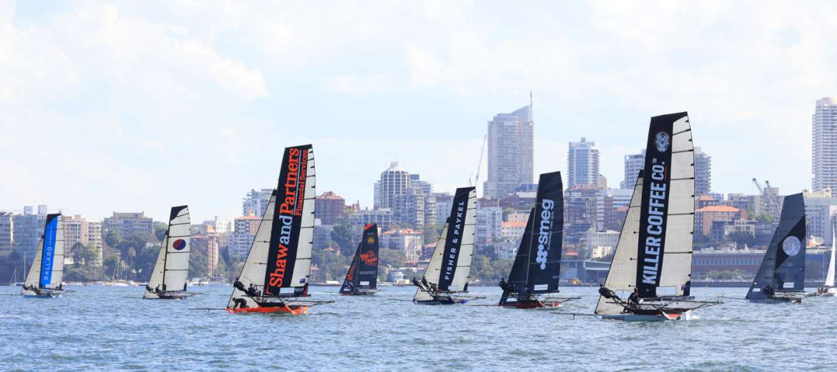 Sotheby's Bllard Property leads the fleet across the harbour in Race 2 (SailMedia)