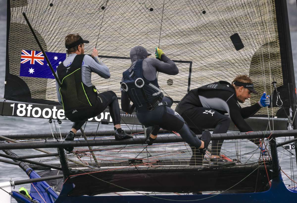 Yandoo's bowman Lewis Brake going for the spinnaker (SailMedia)