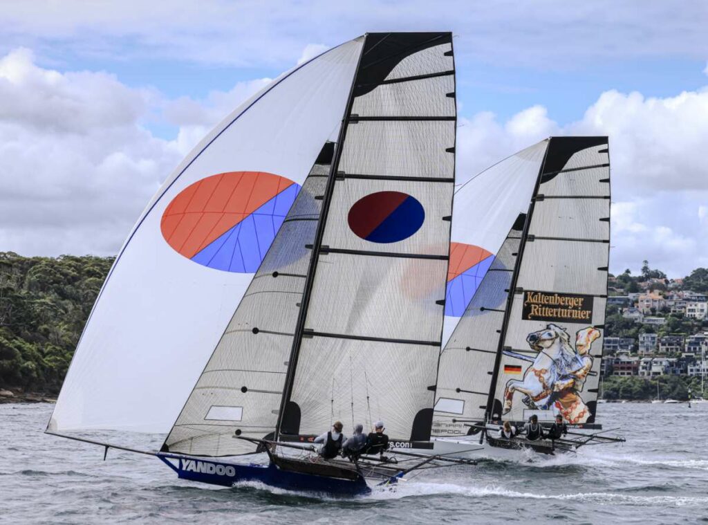 Yandoo rolls over Black Knight on the final run (SailMedia)