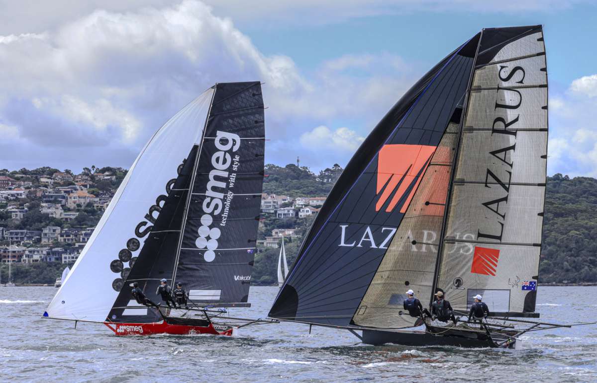 Two top competitors under spinnaker (SailMedia)