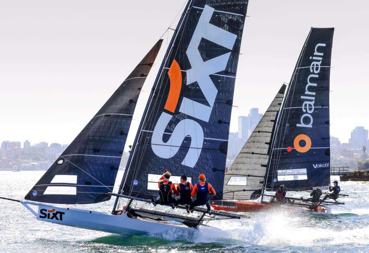 Sixt team shows its boat speed alongside the Australian champion Balmain skiff (SailMedia)
