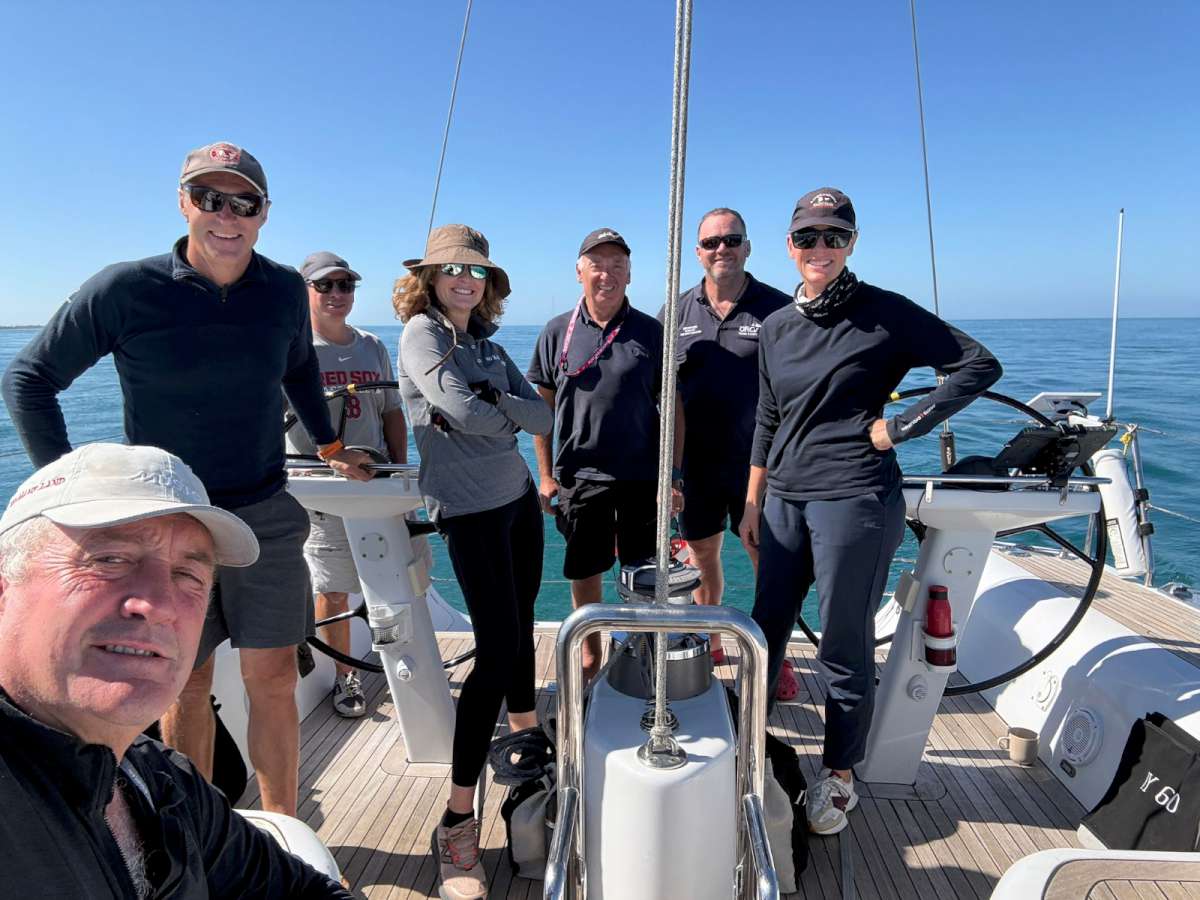 The crew of Belle relaxing prior to the start of the 2026 Melbourne to King Island Yacht Race Photo supplied by Belle