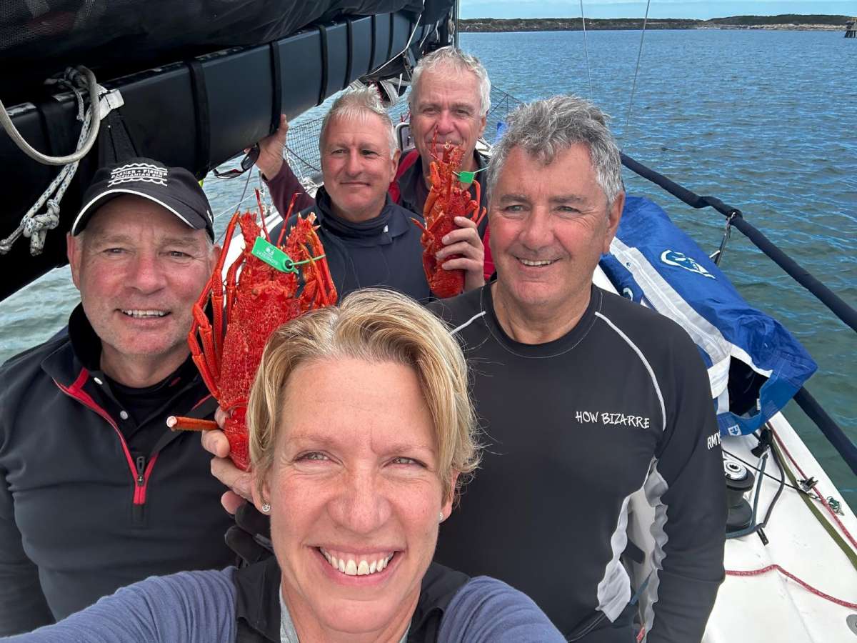 The crew of How Bizarre celebrating the best prize of all-King Island crayfish-credit Rachel McGuigan