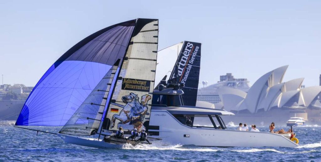 The two leaders battle harbour traffic on the first spinnaker run (SailMedia)