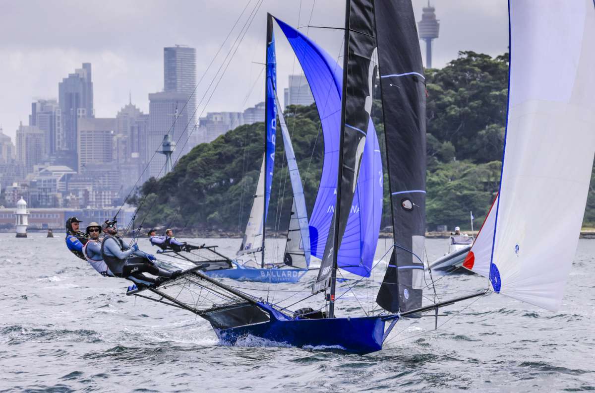 The Andoo USA team on a spinnaker run to Chowder Bay in 2026 (SailMedia)