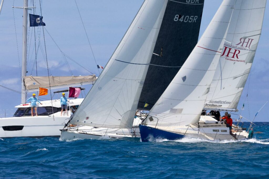 Close racing and leisurely cruising on the final day of Antigua Sailing Week © Tim Wright - Photoaction.com