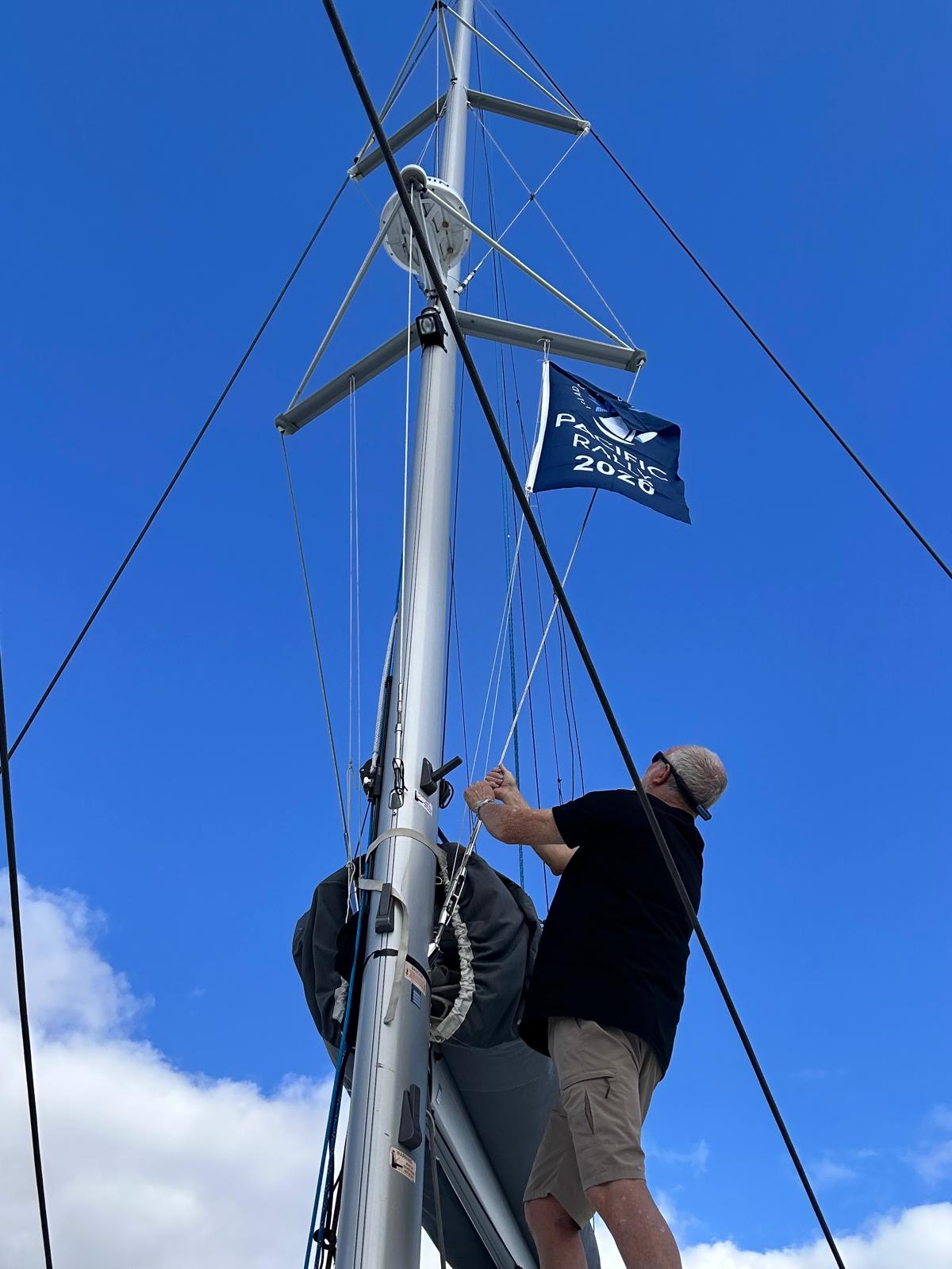 Roger from Aroha raises the Pacific Rally flag