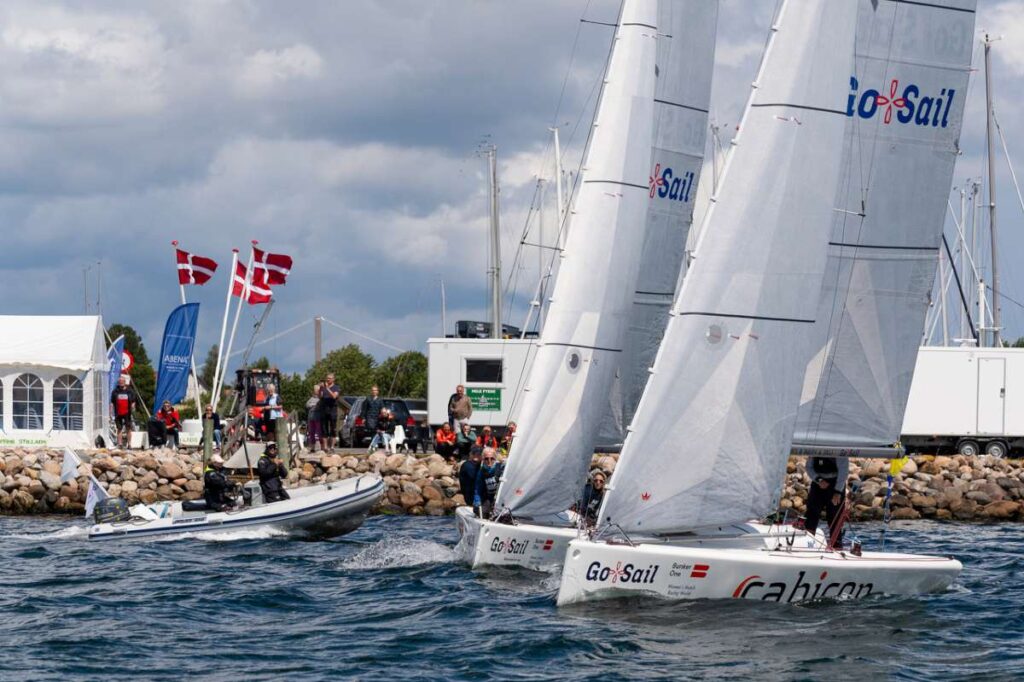 Close action just metres from the sea wall on Middelfart Marina. Photo from the 2023 Women's Matchracing World Champs. Photo Credit Mick Anderson