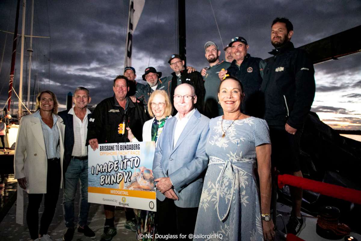 Wedgetail crew on the dock in Bundaberg with Her Excellency the Governor of Queensland, Dr Jeannette Young AC PSM, her husband Professor Graeme Nimmo RFD, and Bundaberg Region Mayor Helen Blackburn