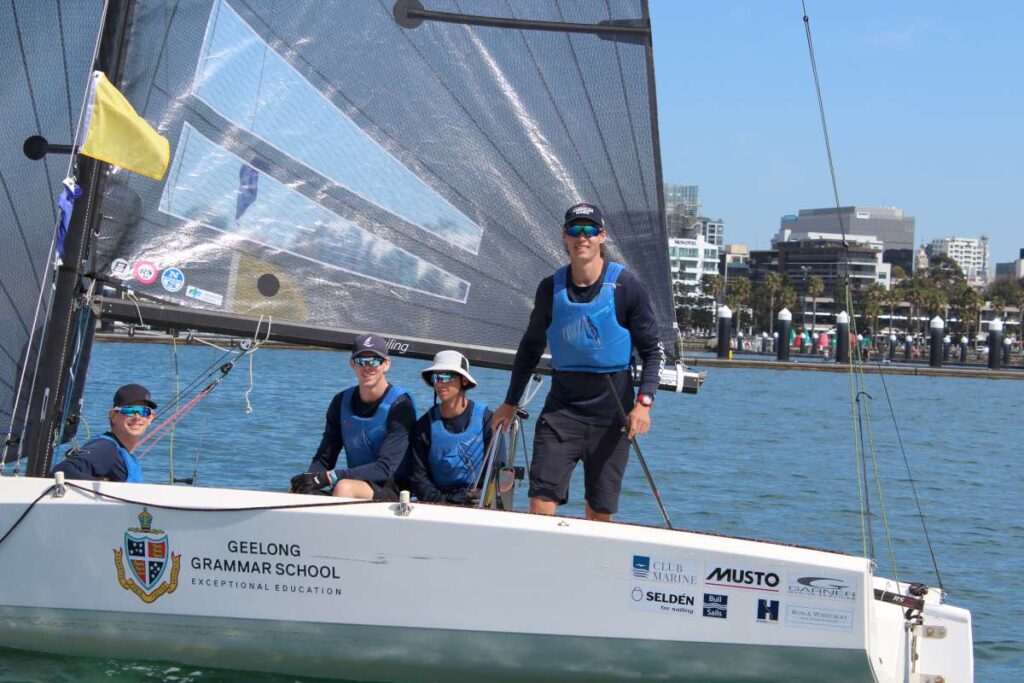 Louis Tilly (standing) and the winning crew from Royal Prince Alfred Yacht Club - William Hough, William Troop, Oliver Ross