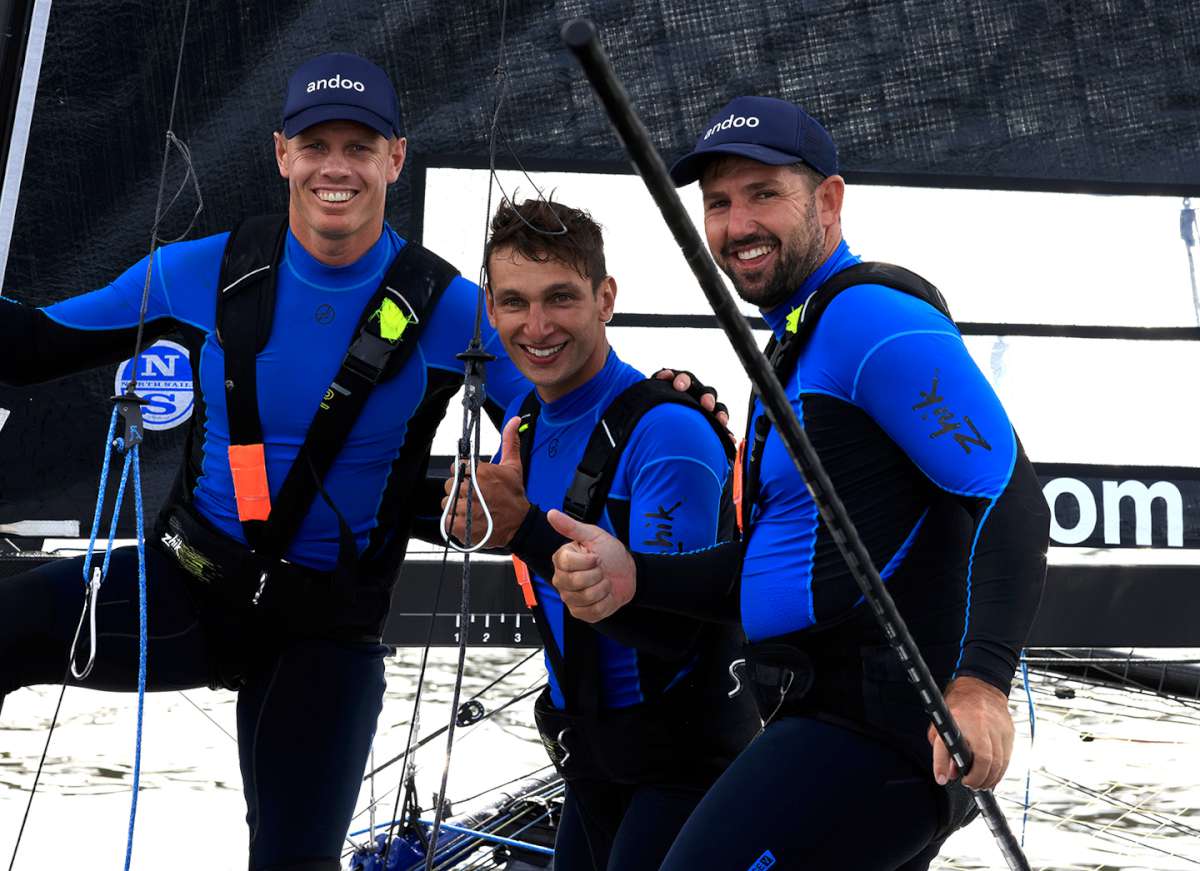 Matt Stenta with Sam Newton and Seve Jarvin after winning the 2022 JJ Giltinan World Championship (SailMedia)