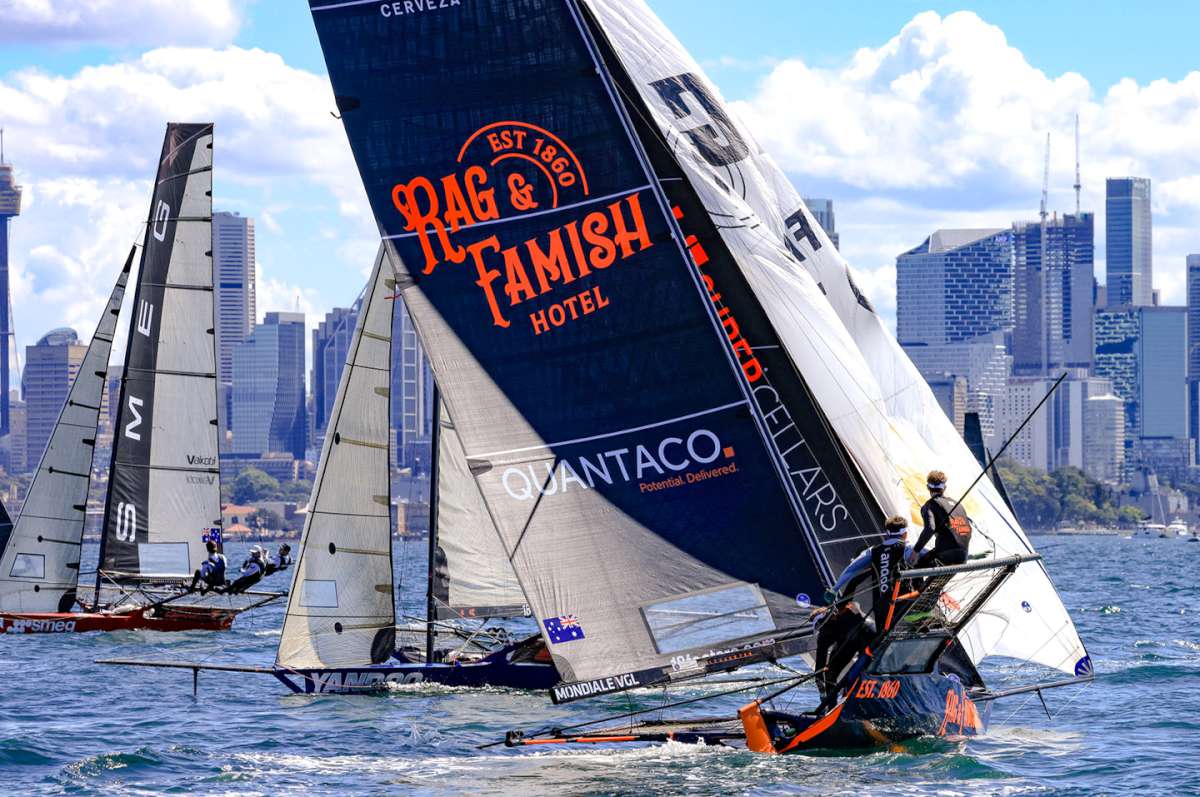 Rag & Famish sets spinnaker after rounding weather mark in the lead (SailMedia)